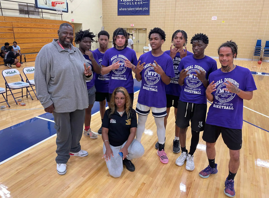 Youth basketball group photo at Villa Maria College gymnasium