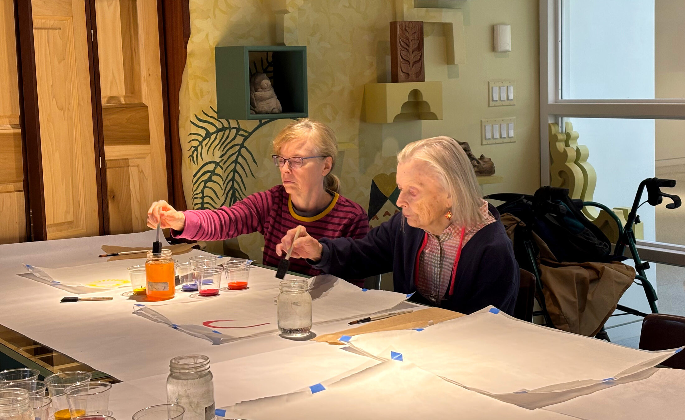 Older adult women painting